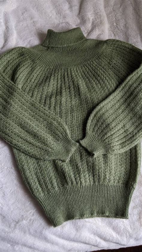 green knit sweater.